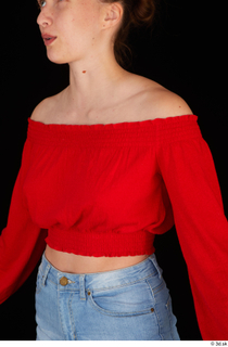 Stacy Cruz casual dressed red off shoulder top upper body…